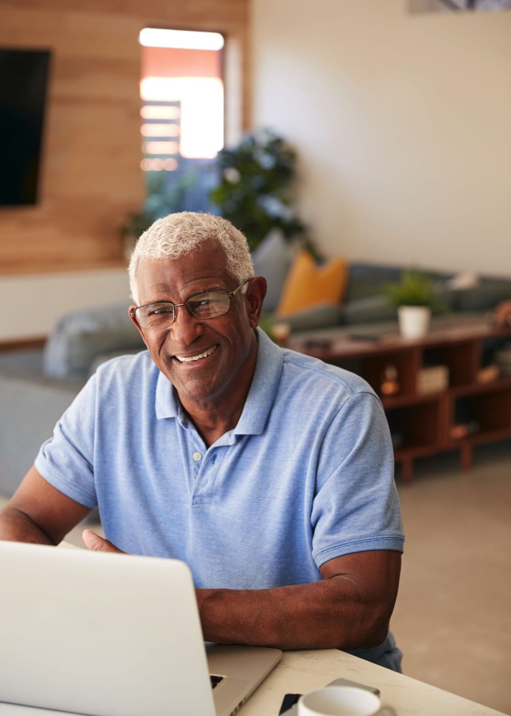 portrait-of-senior-african-american-man-using-lapt-T45PUPA.jpg